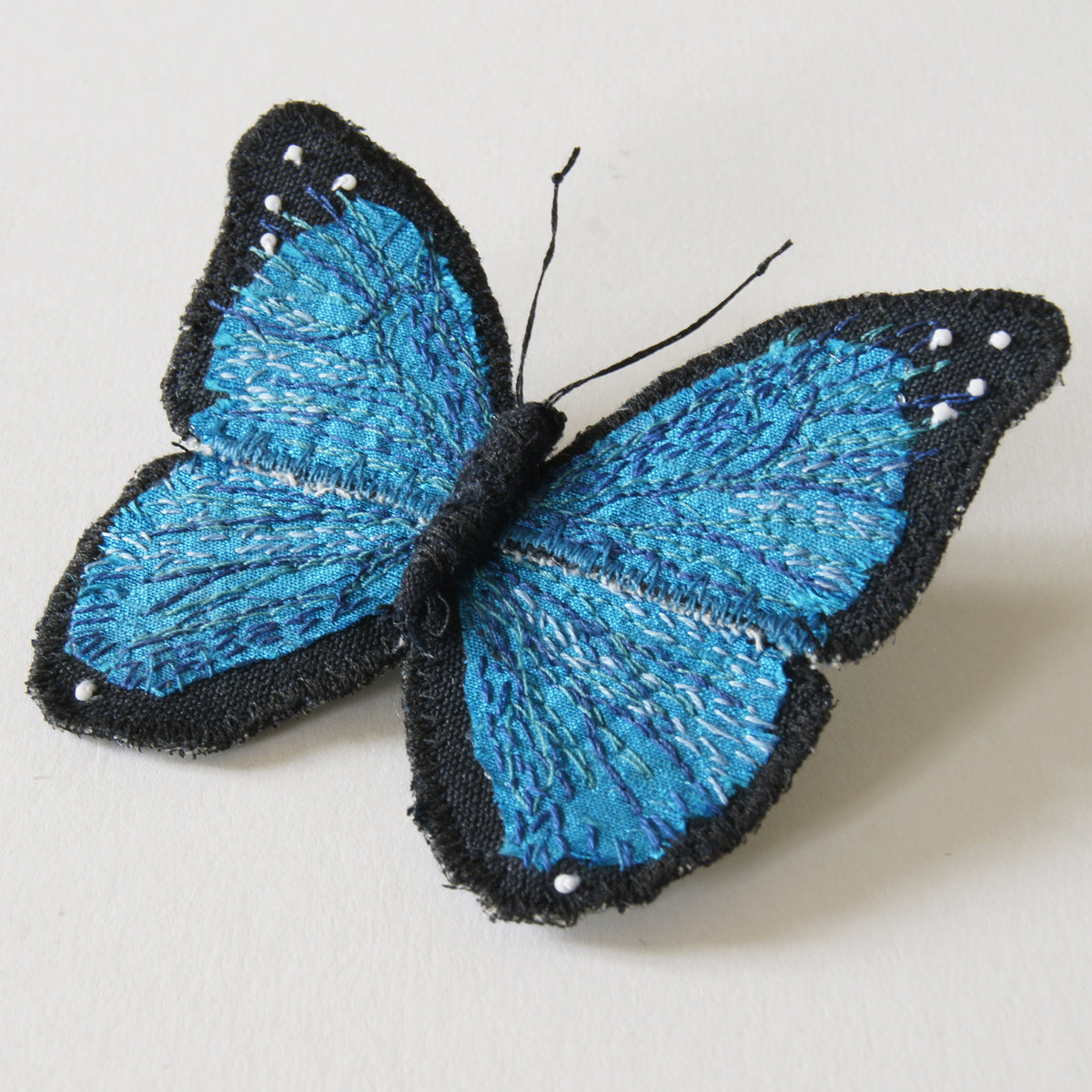 Menelaus blue morpho fiber art brooch
