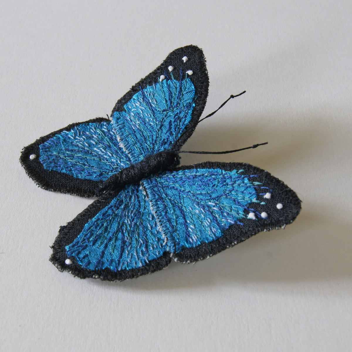 Menelaus blue morpho fiber art brooch