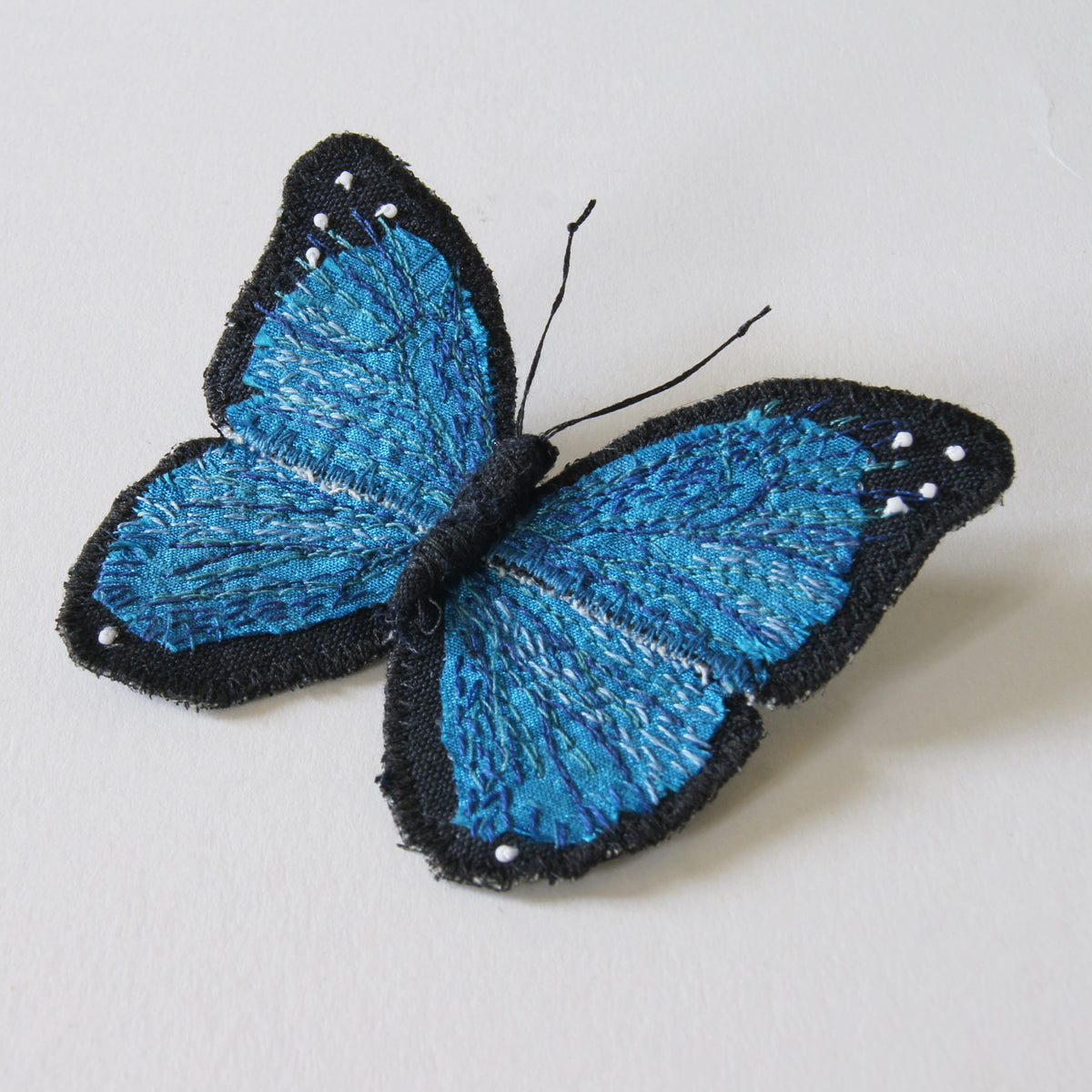 Menelaus blue morpho fiber art brooch