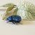 Blue jewel scarab and philodendron leaves textile sculpture